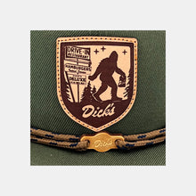 Load image into Gallery viewer, Detail of tan & brown leather patch w/ Sasquatch carrying DDIR bag & pylon sign. Tan laces & wooden "Dick's" cloud logo clip