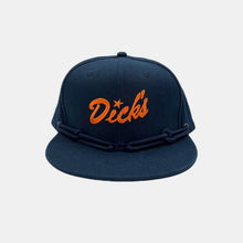 Load image into Gallery viewer, Navy snapback hat w/ embroidered orange "Dick's" script with navy laces and navy Dick's cloud logo metal clip