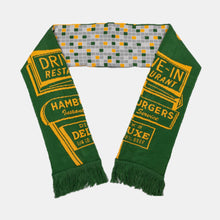 Load image into Gallery viewer, Dick&#39;s Drive-green/yellow reversible woven scarf with square tile pattern on one side and Dick&#39;s pylon sign on the other
