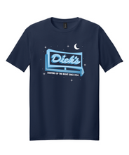 Load image into Gallery viewer, Navy blue, glow-in-the-dark T-shirt with the &#39;Dick&#39;s&#39; pylon-sign logo and &quot;Lighting Up the Night Since 1954&quot; text.
