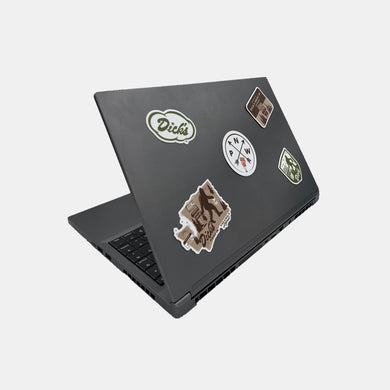 Laptop with 5 miscellaneous olive green, brown and orange Dick's Drive-In PNW stickers on front