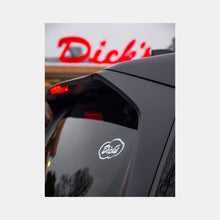 Load image into Gallery viewer, Rear car window with Dick&#39;s Drive-In white cloud logo vinyl decal on upper right corner and restaurant sign in background
