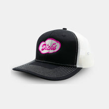 Load image into Gallery viewer, Side View white and black trucker hat with white stitching and magenta &quot;Dick&#39;s&quot; Drive-In cloud logo on front
