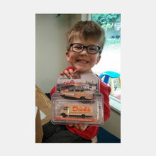 Load image into Gallery viewer, Young boy holding packaged Dick&#39;s Drive-In Food Truck toy
