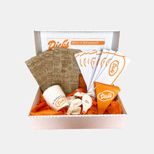 Load image into Gallery viewer, Dick&#39;s Drive-In Party Pack with paper bags, sundae cups, balloons, paper hats and triangle banner in white burger box
